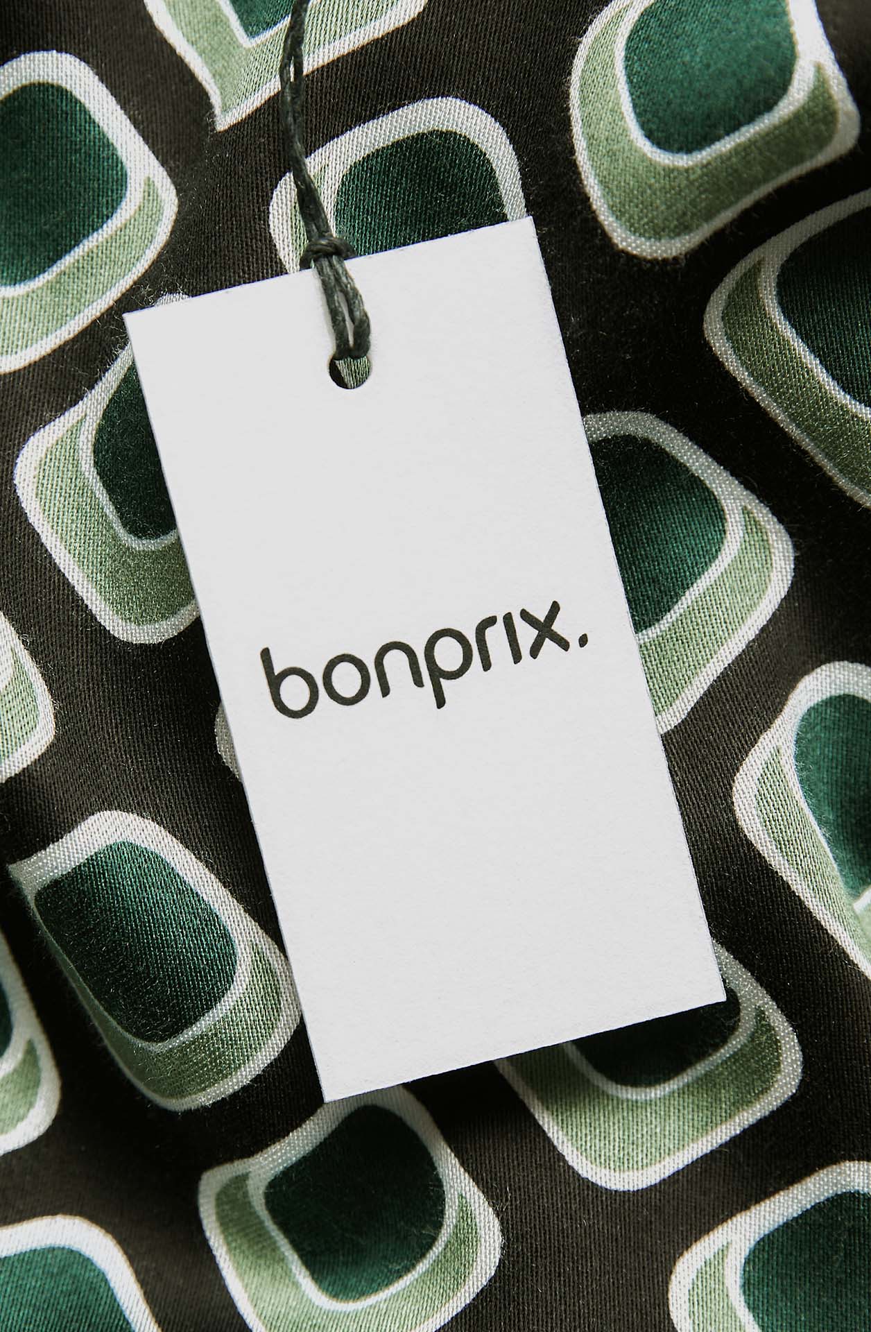 Bonprix Hangtag on green textile.
