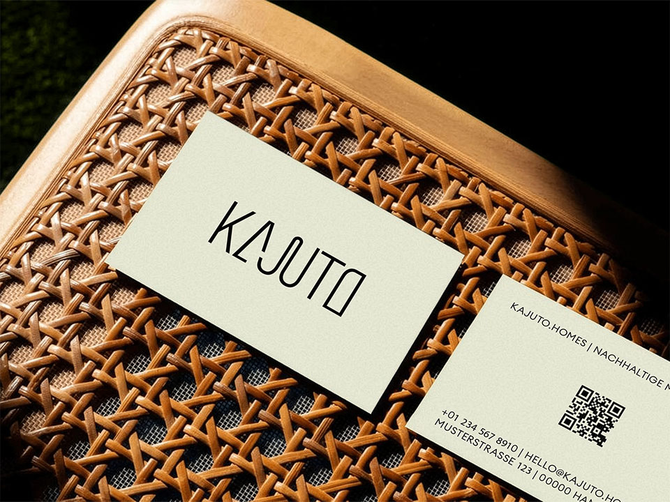 Kajuto Business Cards displayed on a chair.